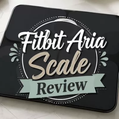 Black Fitbit Aria smart scale with centered decorative text that reads Fitbit Aria Scale Review.