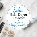Solia hair dryer with concentrator nozzle on a white marble countertop.