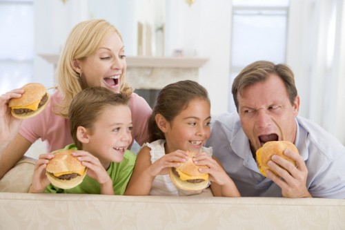 Family Eating Cheeseburgers Together