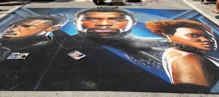 Street Painting Festival Lakeworth Large chalk portrait artwork displayed on pavement at the Lake Worth Street Painting Festival.