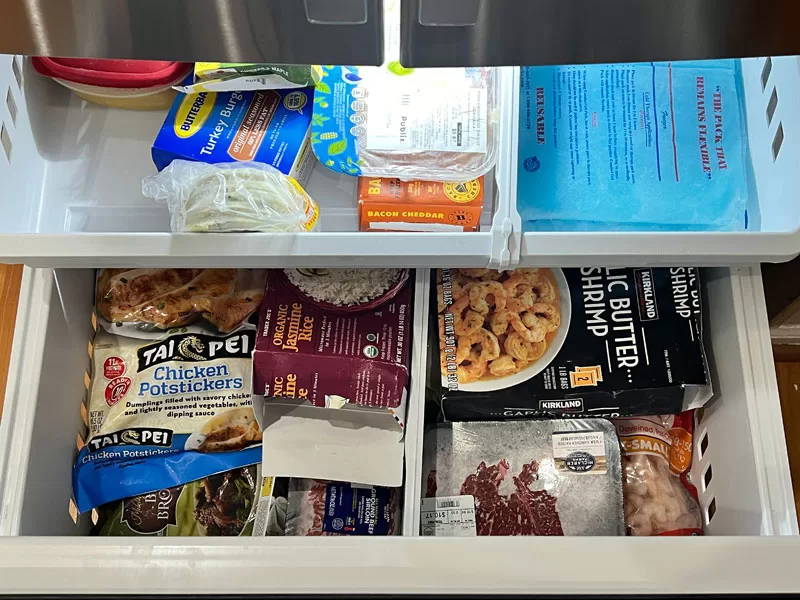 GE GFE26JYMFS bottom freezer drawer with organized frozen food storage compartments