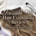 Caramel balayage clip-in hair extensions on a white marble vanity with a purple hairbrush, curling iron, and decorative review text.
