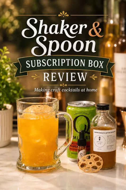 Orange craft cocktail with mixer can, syrup bottle, bitters, and dried garnish on a warm home bar counter