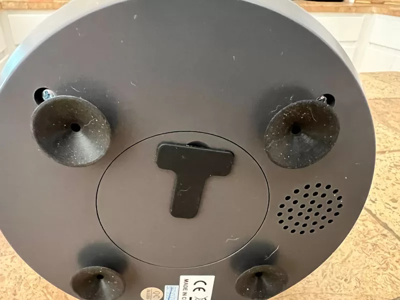 Bottom of the WOPet Guardian Dog Treat Camera showing four suction cups for secure placement.