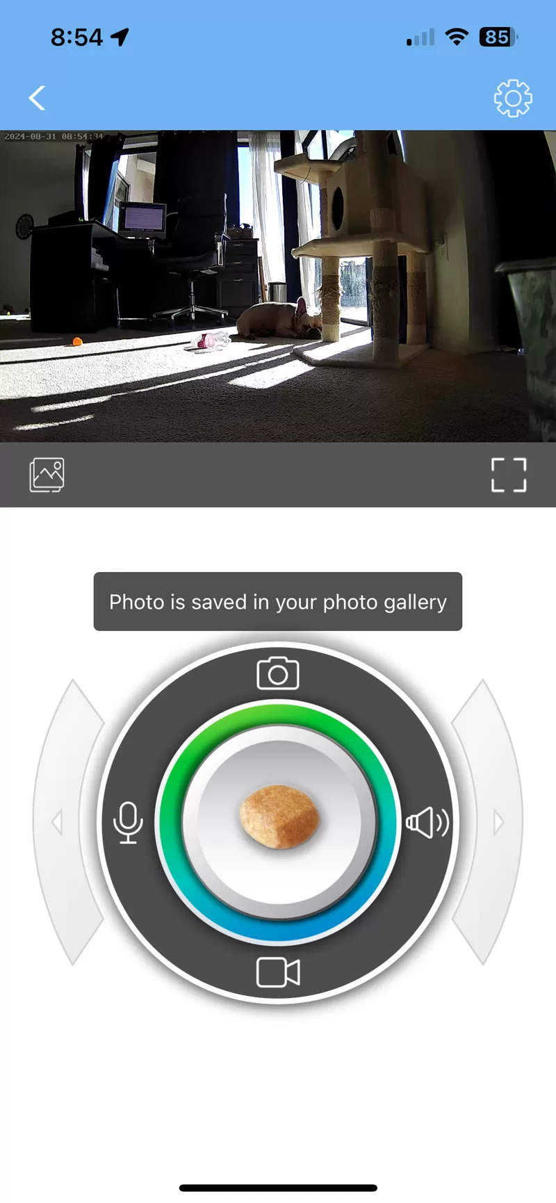 WOPet Smart App screen showing the live pet camera view, treat button, audio controls, and 360-degree rotation controls.