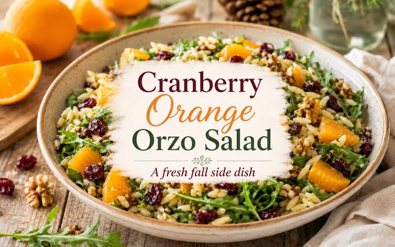 Cranberry orange orzo salad with dried cranberries, orange segments, walnuts, and arugula with a centered recipe title graphic
