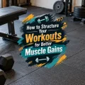 Strength-training equipment with a decorative graphic title treatment about structuring workouts for muscle gains