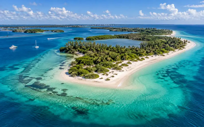 Turquoise water surrounding a tropical Florida island with boats near the shoreline